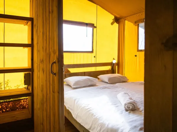 The Roan Lodgetent Premium XL bedroom with spacious double bed.