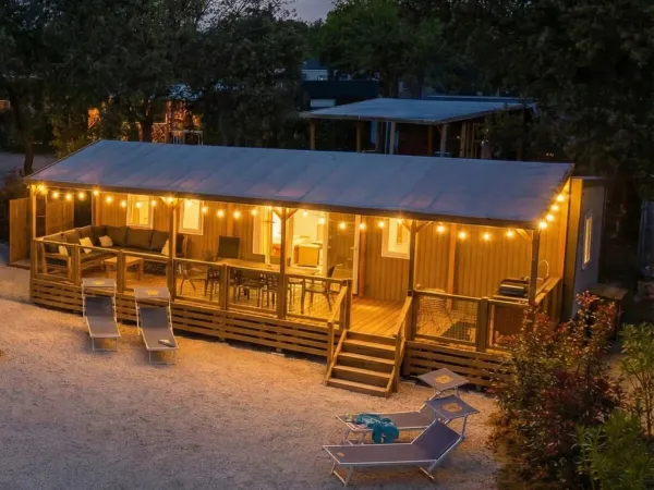 The Supreme Deluxe Lounge Premium Zone with mood lighting on the veranda.