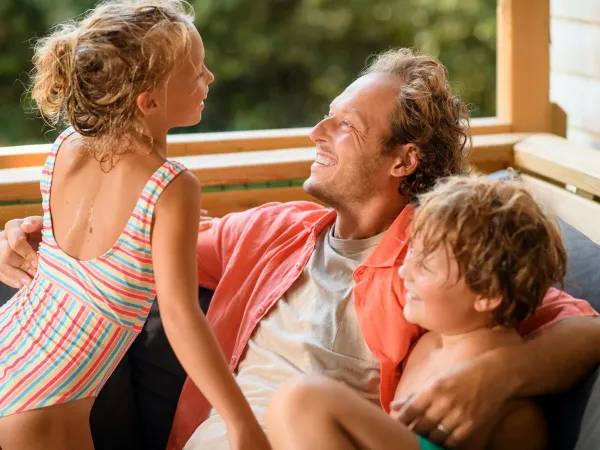 Enjoying and laughing together on the veranda.