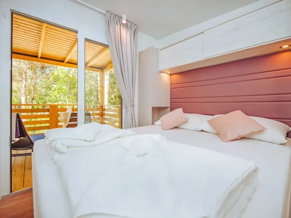 The Roan Comfort Plus Lounge bedroom with double bed.