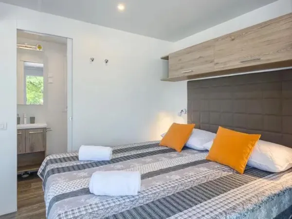 The Roan Premium Lounge bedroom with double bed.