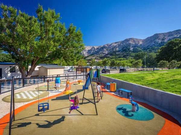 Small playground at Roan camping Baška Camping Resort.