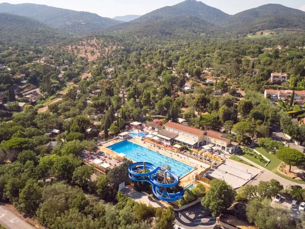 Olympic-size pool with slide at Roan camping Domaine Naïades.