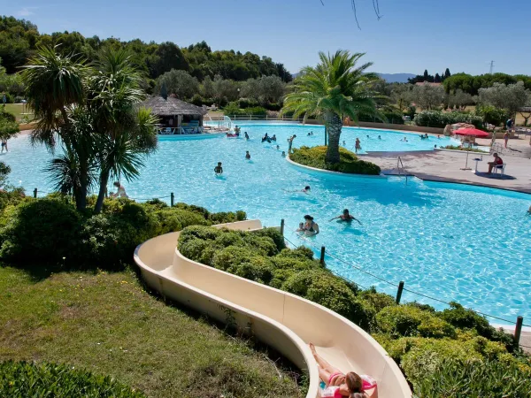 Swimming pool with slide at Roan camping Le Capanne.