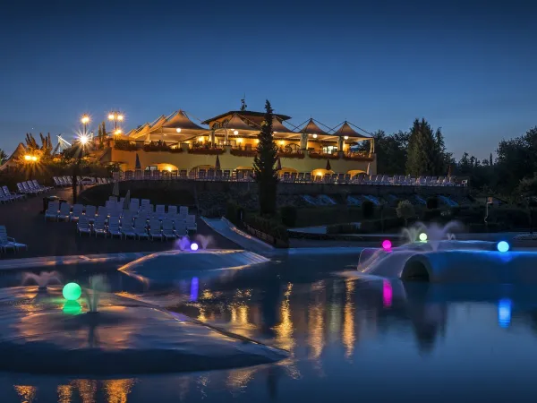 Lagoon pool overlooking restaurant at Roan camping Norcenni Girasole.