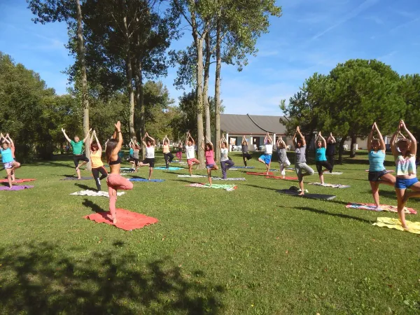 Yoga on the lawn at Roan camping Pra'delle Torri.