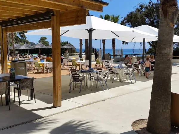 A terrace at Roan camping Cala Gogo.