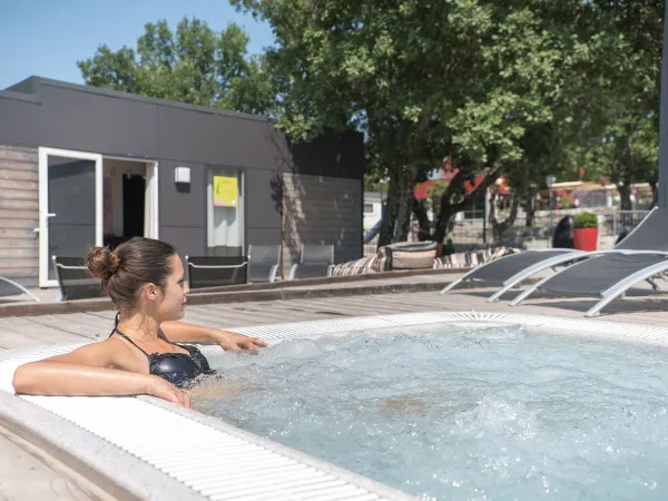 Relax in the Jacuzzi at Roan camping Aluna Vacances.
