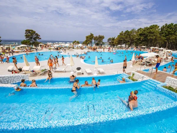 Outdoor pools by the beach at Roan campsite Zaton Holiday Resort.