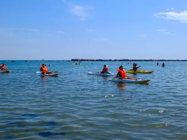 Canoeing in the sea at Roan camping Rubicone.
