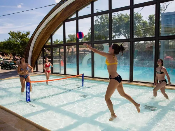 Volleyball game in the pool at Roan camping Le Ranc Davaine.