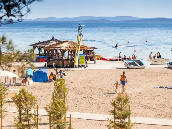 Beach with water sports facilities at Roan campsite Zaton Holiday resort.
