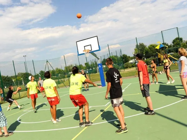 Playing basketball at Roan camping Turistico.