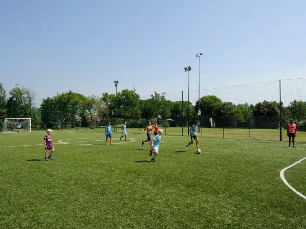 Playing soccer at Roan camping Turistico.