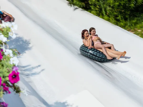 Slide down the wide waterslide at Roan camping hu Altomincio village.