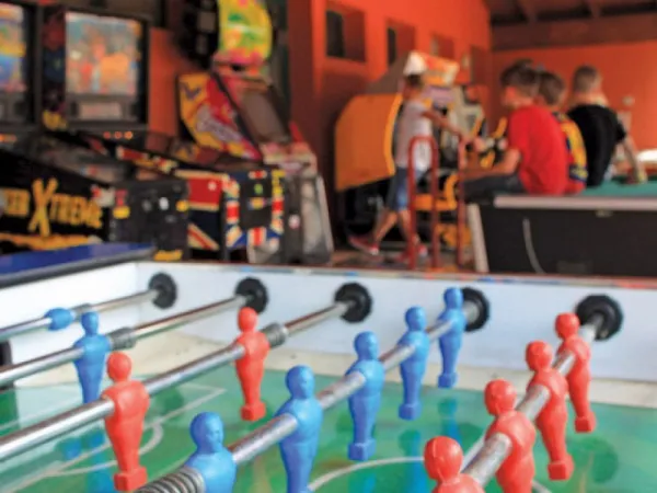 Table soccer and slot machines at Roan camping Spiaggie e Mare.
