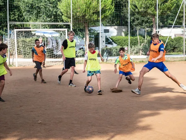 Children playing soccer at Roan camping Park Albatros.