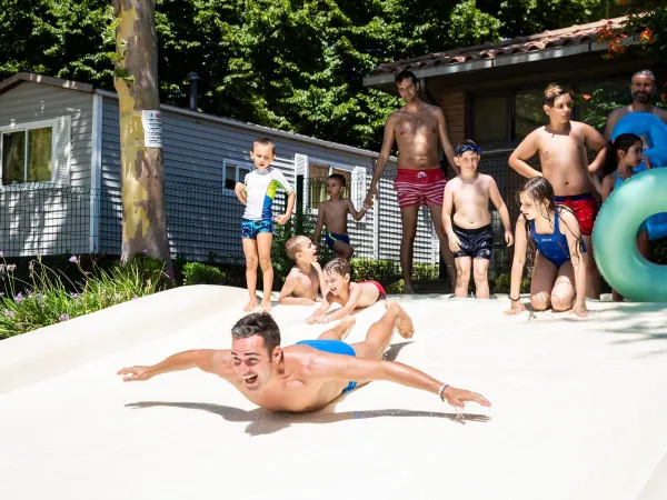 Sliding boy at Roan camping hu I Pini village.