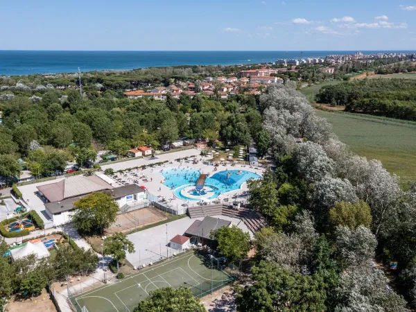 Drone shot of the swimming pool at Roan camping Adriano Village.