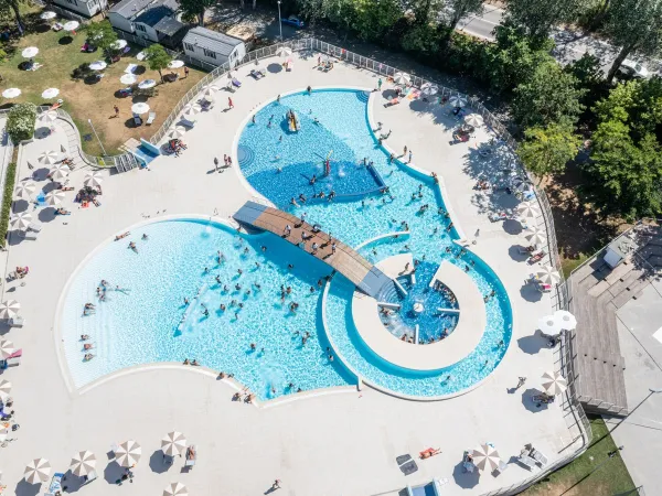 Drone shot of the swimming pool at Roan camping Adriano Village.
