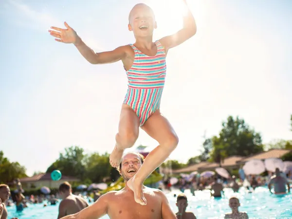 Jumping child in pool.