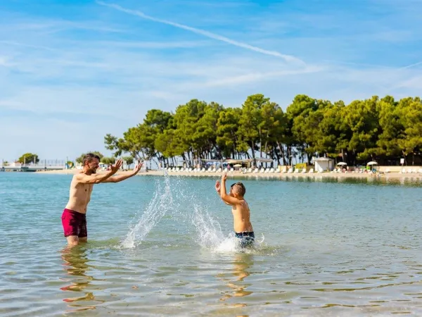 Water fun at the beach near Roan camping Stella Maris.