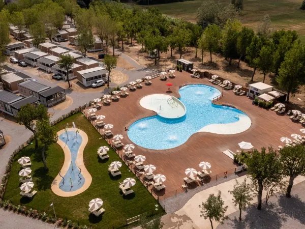 Swimming pool and spray park at Roan camping Rimini Family Village.