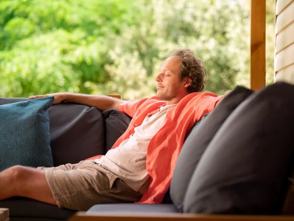 Rest by the lounge sofa of Roan accommodation at Vilanova Park campsite.