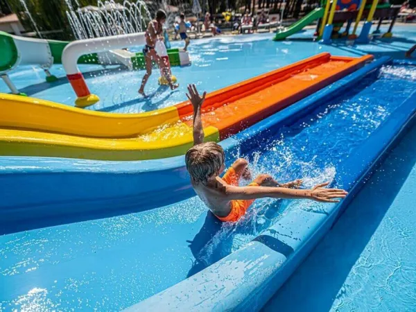 Slide at water playground at Roan camping Bi Village.