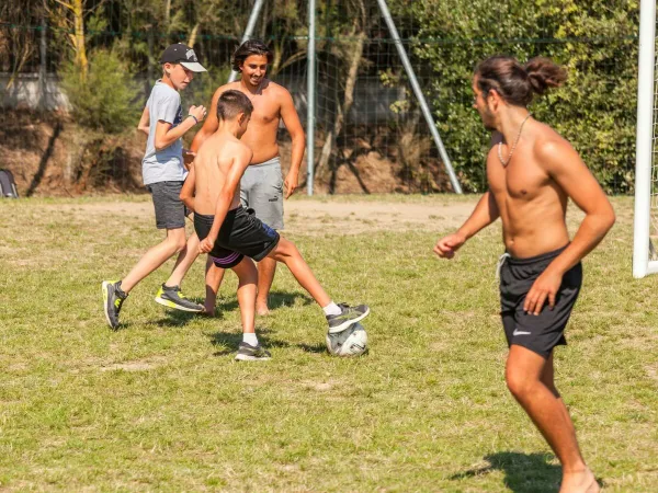 Playing soccer at Roan camping Le Domaine du Clarys.