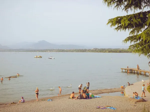 Beach at the lake at Roan camping Bella Italia.