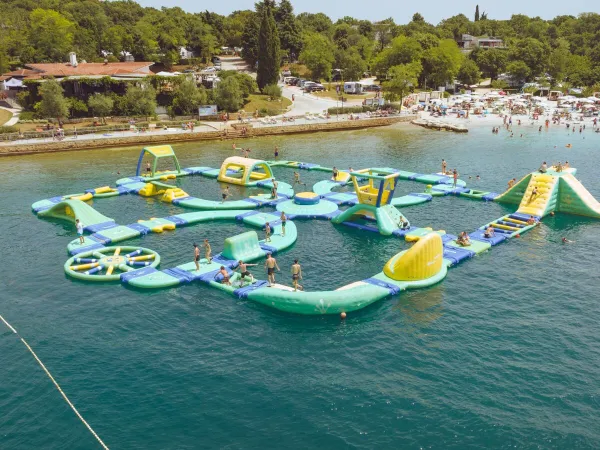 Water playground in the sea at Roan camping Lanterna.