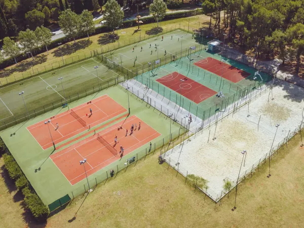 Tennis and soccer fields at Roan camping Bi Village.