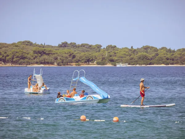 Pedal boats with slide at Roan camping Bi Village.