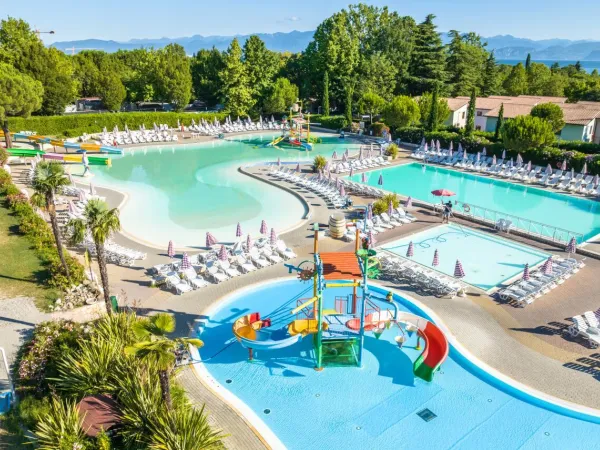 Overview of Roan camping Bella Italia's diverse pool area.