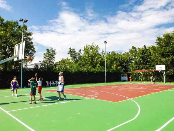 Playing basketball at Roan camping San Francesco.