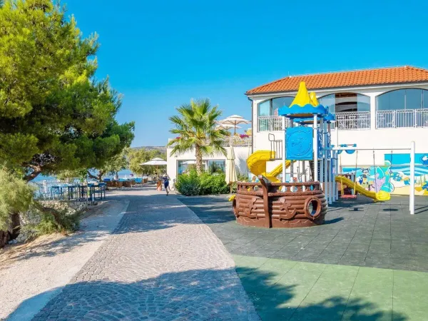 Playground and promenade at Roan campsite Amadria Park Trogir.