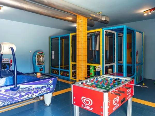 Games arcade at Roan camping hu I Pini village.