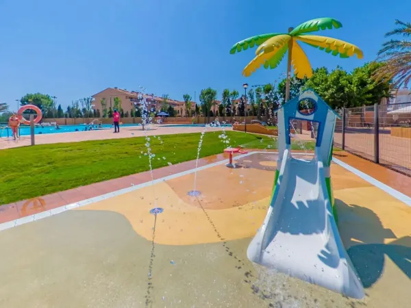 Water slide for the little ones in the spray park at Roan camping Platja Brava.