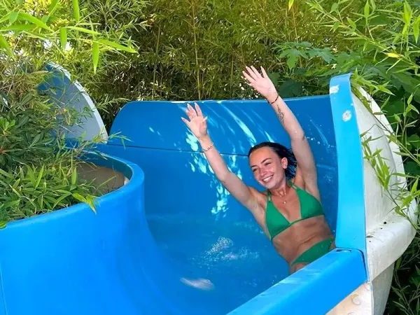 Girl slides down the waterslide at Roan camping Méditerranée Plage.