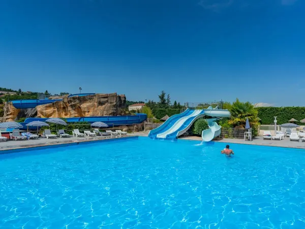 Families take a dip in the pool at Roan camping Chateau de Galaure.