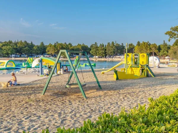 Playground on the beach at Roan camping Valkanela.