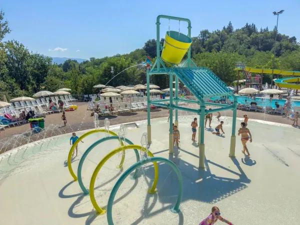 Children's pool with soft surface and sliding hills at Roan camping hu Norcenni Girasole village.