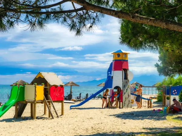 Playground on the beach at Roan camping Arinella Bianca.