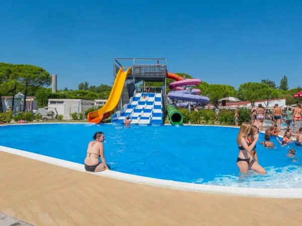 Swimming pool with fun slides at Roan campsite Marina Julia Camping Village.