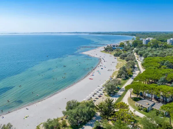 Aerial view of the beach at Roan campsite Marina Julia Camping Village.
