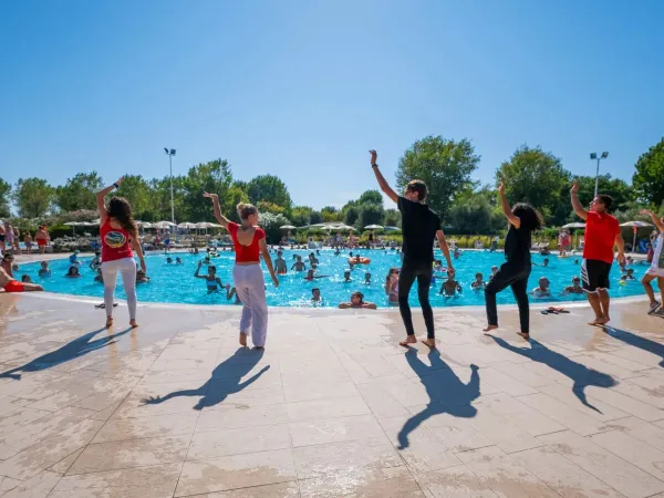 The animation team enthusiastically giving aqua aerobics to guests.