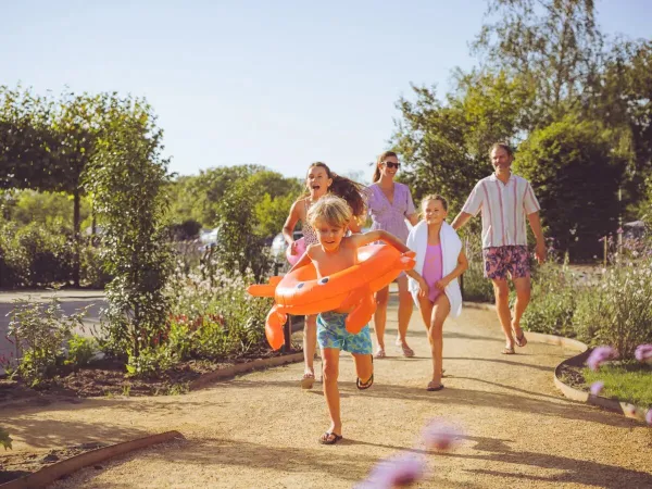 Family on their way to the pool.