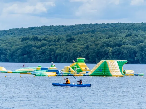 Water jumping and canoeing on the lake at Roan camping Le Lac des Vieilles Forges.
