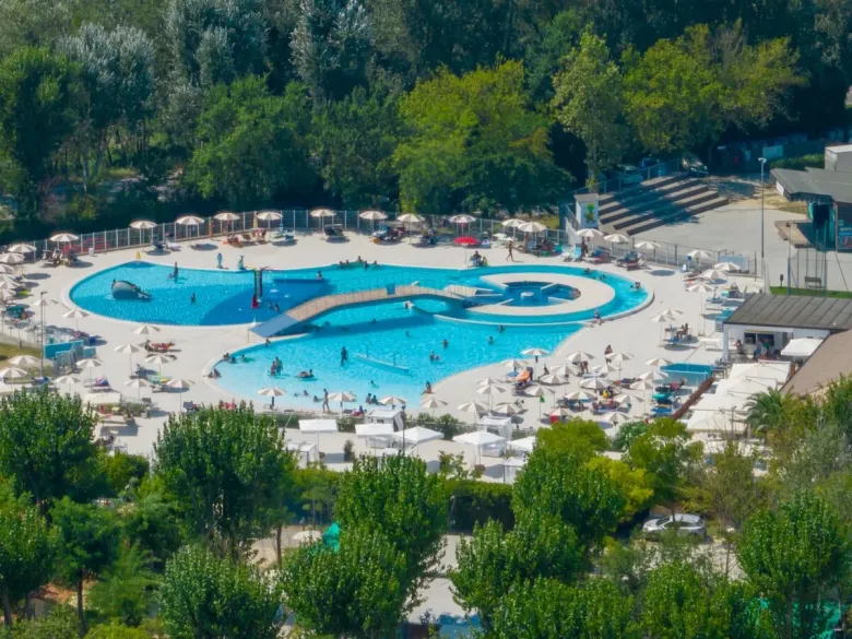 Drone shot of the swimming pool at Roan camping Adriano Family Collection.